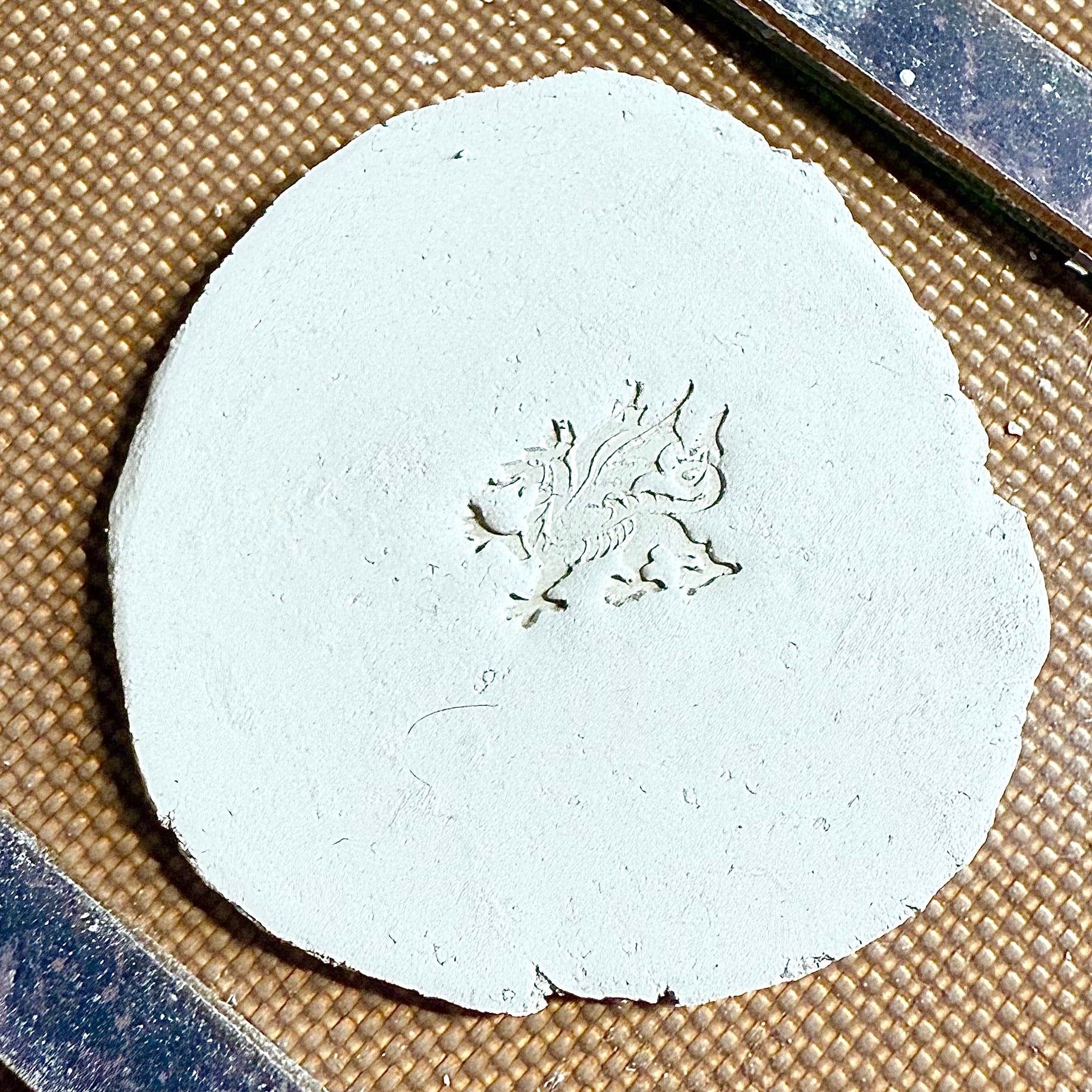 silver clay with a welsh dragon stamped into it
